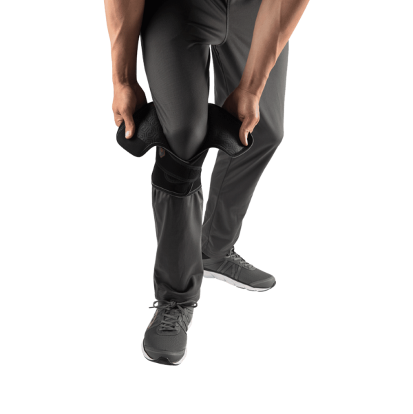 McDavid VOW™ Versatile Over Wrap Knee Wrap w/Stays worn over trousers