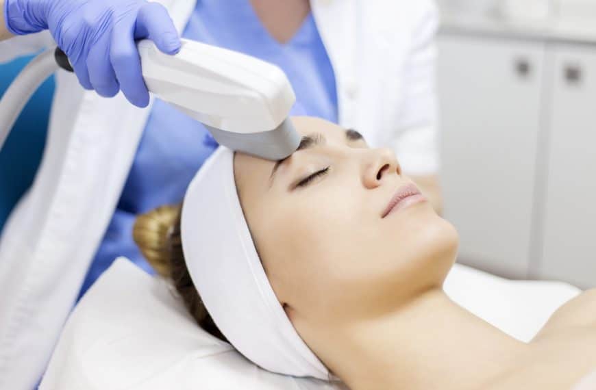 Woman receiving facial laser therapy