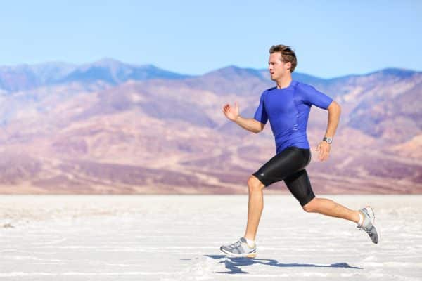 Male athlete  wearing compression wear (shorts) and sprinting