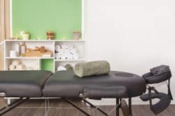 Side view of a physical therapy treatment table.